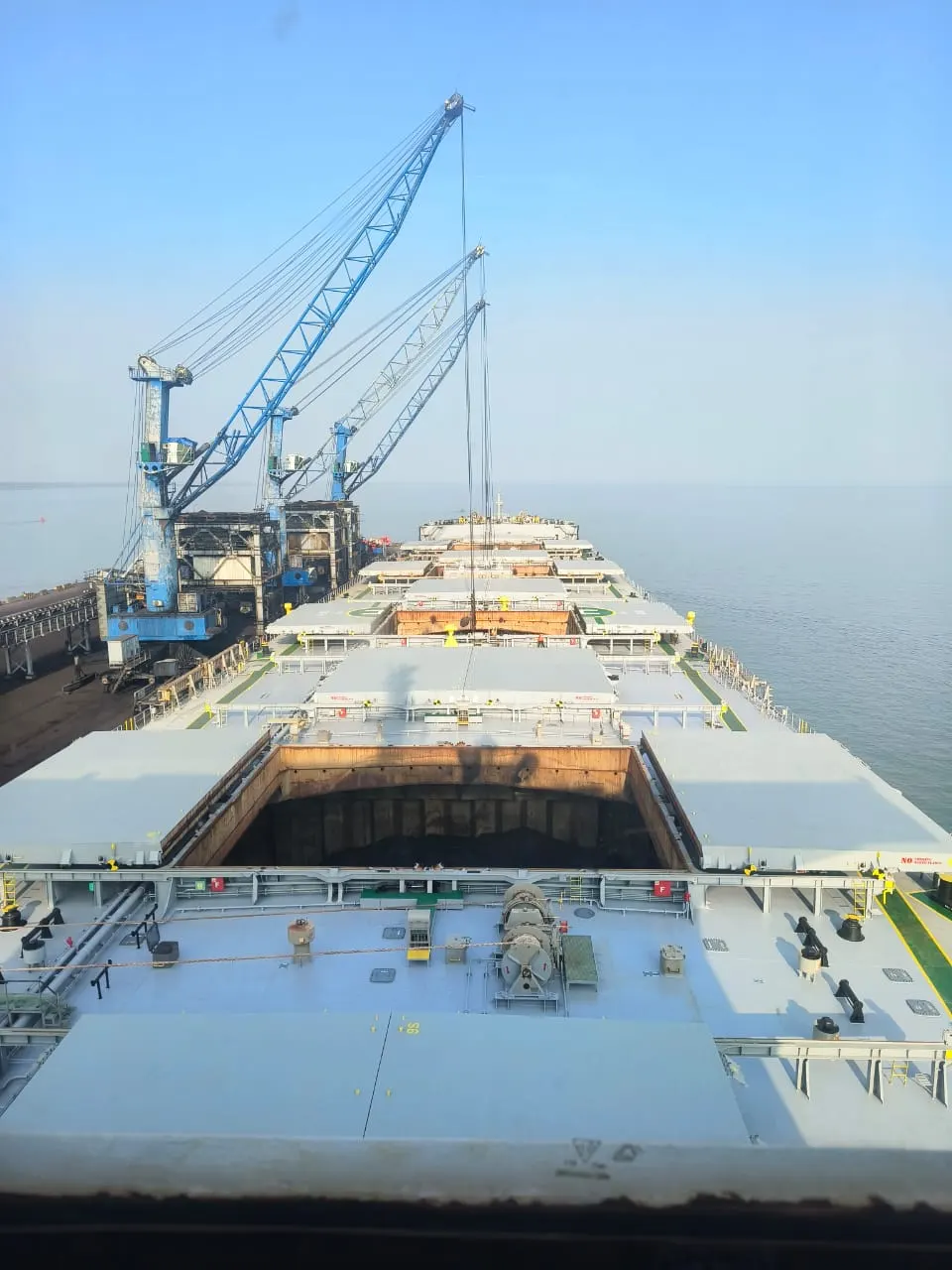 Grab loading salt into the hold alongside the berth