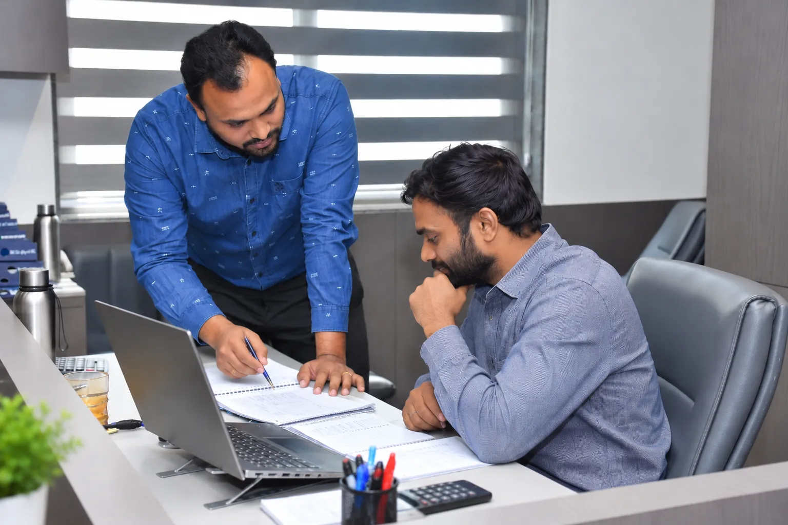 Cross Trade Shipping brokerage team reviewing charter figures
